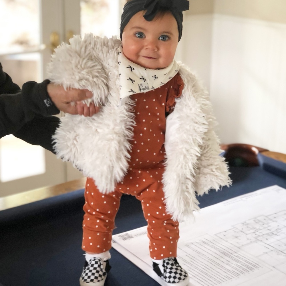 Rust with white polka dot ruffled jumpsuit